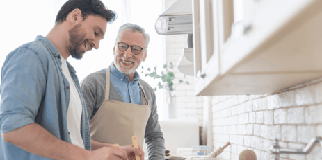 A father cooking a meal with his son