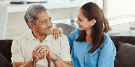 a nurse having a lovely conversation with her elderly patient