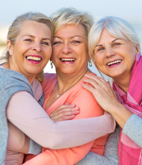 three senior women smiling
