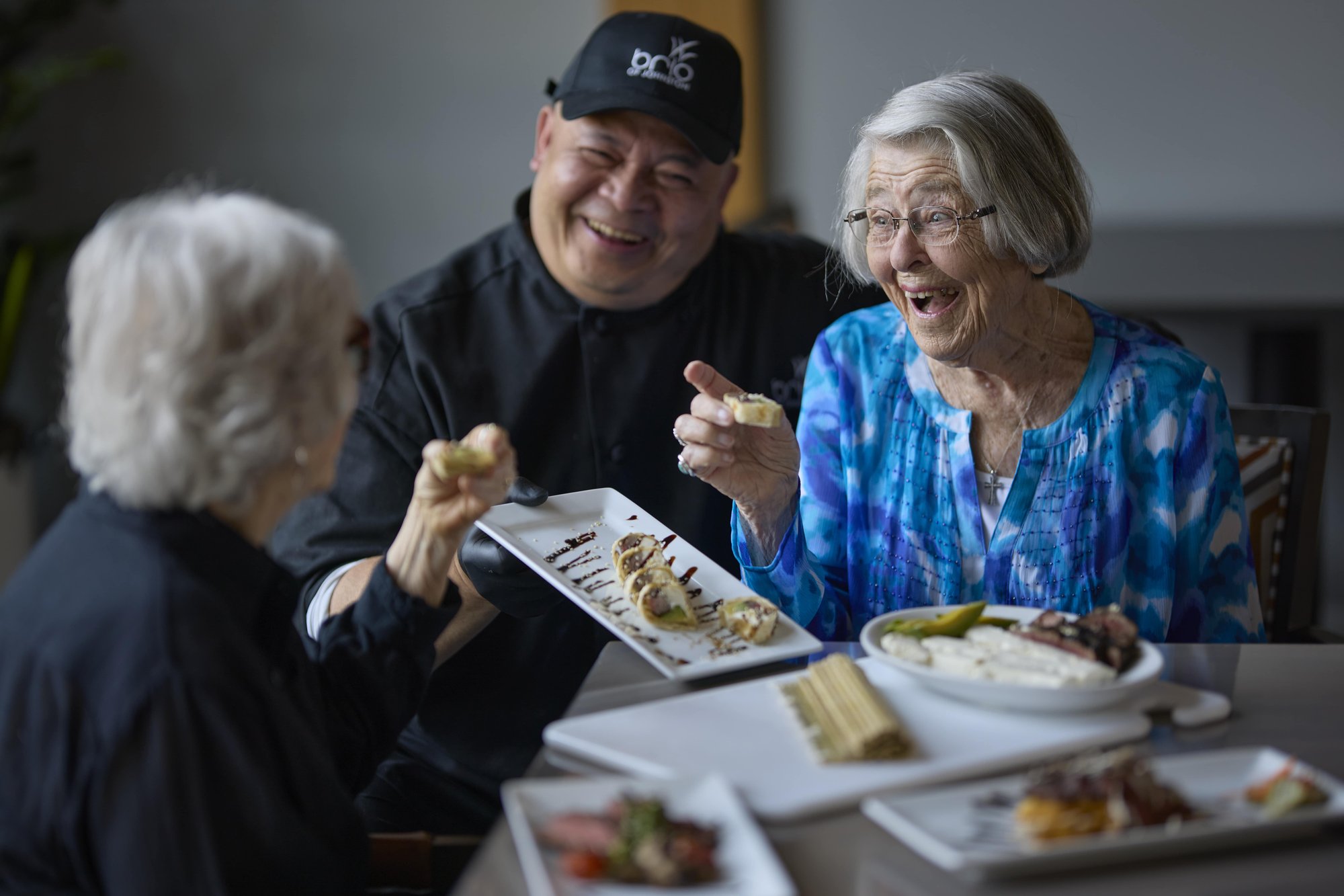 Seniors in the community enjoying food