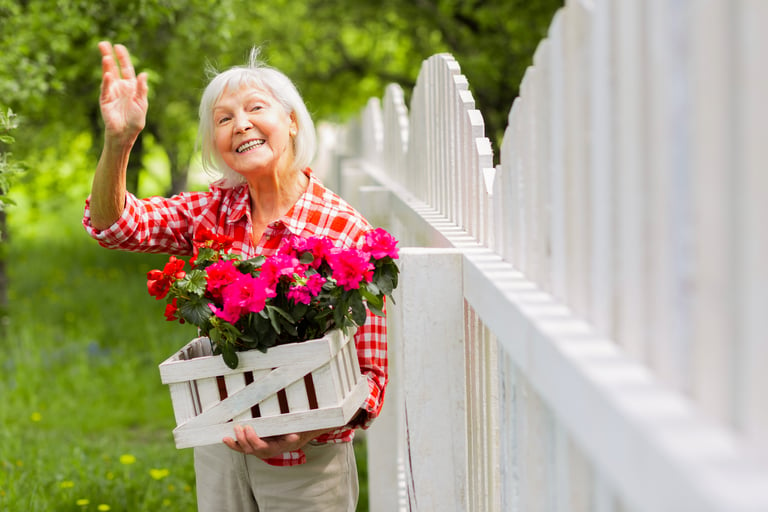 Happy older woman with flowers